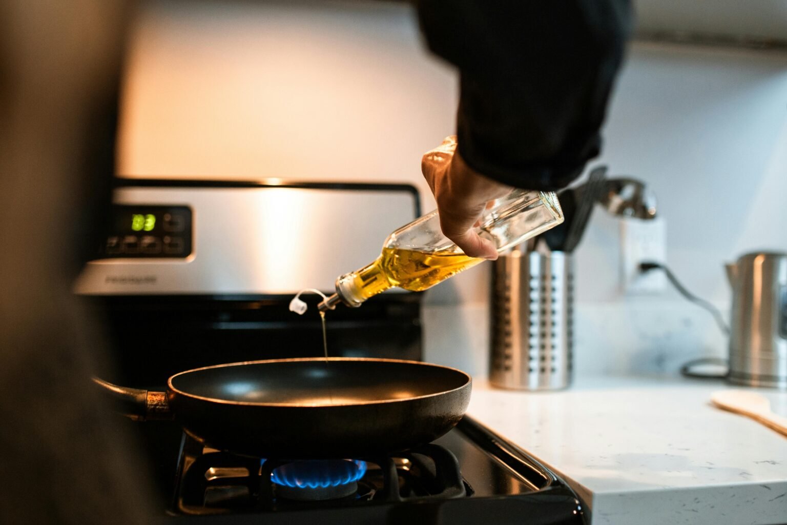 A healthy, fresh salad prepared using a modern olive oil sprayer