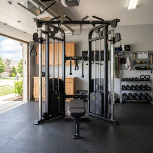 Best functional trainer machine set up in a well-organized, brightly lit garage home gym.